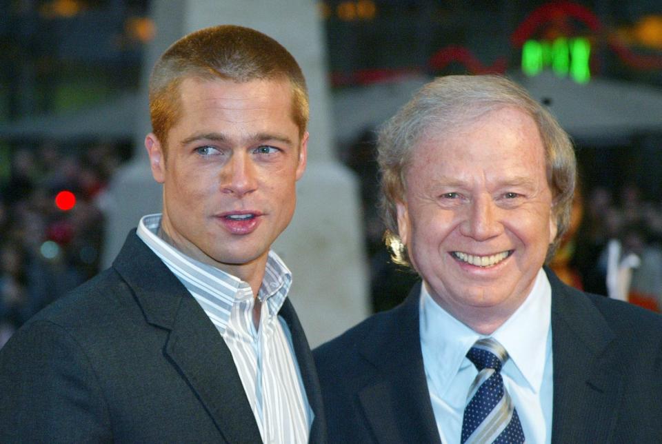 Brad Pitt, left, and German director Wolfgang Petersen appear at the world premiere of "Troy" in Berlin on May 9, 2004. Petersen, 81, died Aug. 12 after a battle with pancreatic cancer.