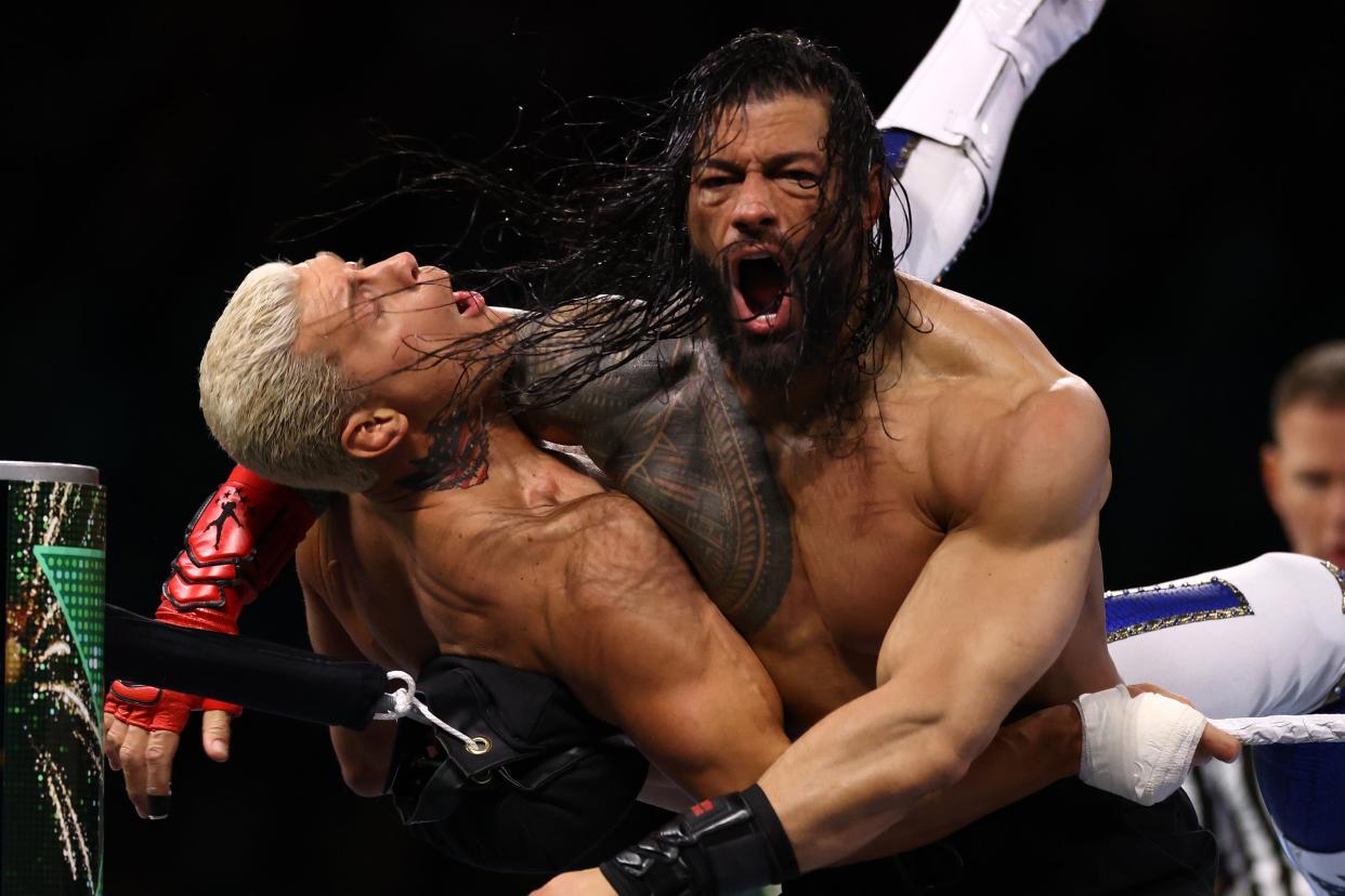 Roman Reigns (right) in action against Cody Rhodes on Saturday (Getty Images)