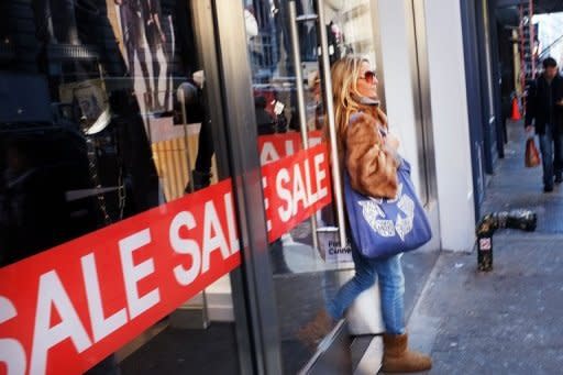 A woman exits a store in New York in 2011. The US economy grew more slowly than thought in the first quarter and lackluster jobs numbers suggested a sluggish second quarter that will do little to help the troubled labor market