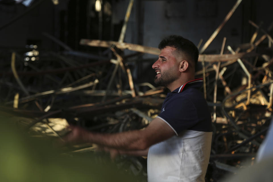 An Iraqi reacts at the site of a fatal fire in the district of Hamdaniya, Nineveh province, Iraq, Wednesday, Sept. 27, 2023. A fire that raced through a hall hosting a Christian wedding in northern Iraq killed multiple people, authorities said Wednesday. (AP Photo/Farid Abdulwahed)