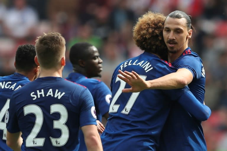 Manchester United's Zlatan Ibrahimovic (R) celebrates scoring the opening goal during their English Premier League match against Sunderland, at the Stadium of Light in Sunderland, on April 9, 2017