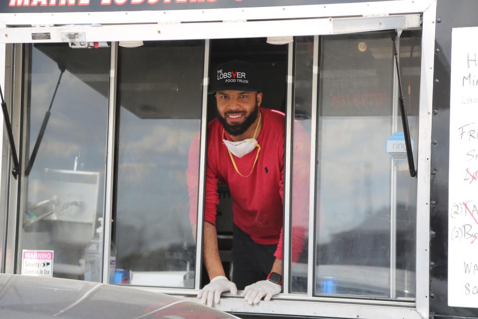 Nick Wilson, co-owner of The Lobster Food Truck, poses for a photo while setting up in the parking lot of the Home Depot in Troy on May 7, 2020.