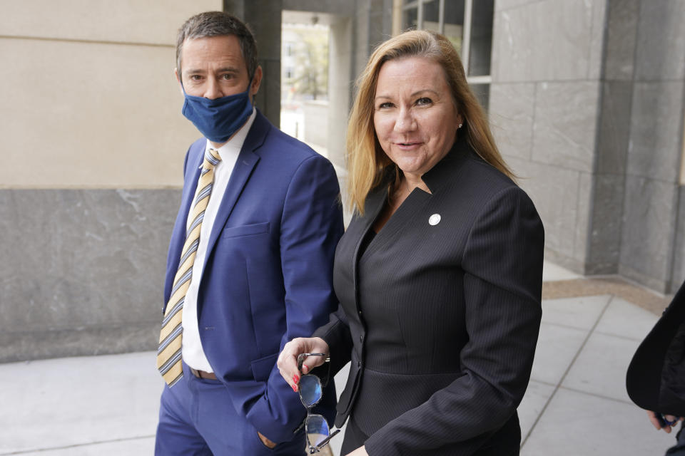 Virginia State Sen. Amanda Chase, R-Chesterfield, right, leaves court with her attorney Tim Anderson during a break in a hearing to dismiss here lawsuit in Federal court in Richmond, Va., Thursday, April 1, 2021. . (AP Photo/Steve Helber)