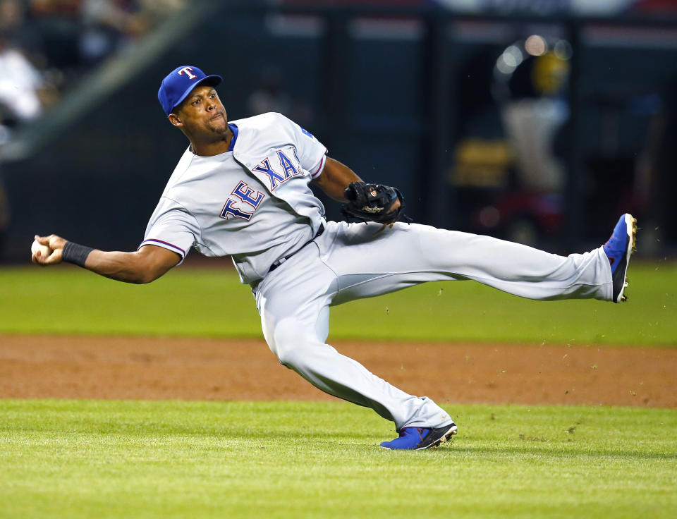 FILE - Texas Rangers third baseman Adrián Beltré throws during the team's baseball game against the Arizona Diamondbacks on July 31, 2018, in Phoenix. Beltré, Todd Helton and Joe Mauer were elected to baseball's Hall of Fame on Tuesday, Jan. 23, 2024. (AP Photo/Rick Scuteri, File)