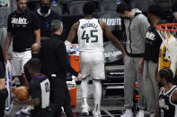 Utah Jazz guard Donovan Mitchell walks off the court with an injury during the second half of Game 3 of a second-round NBA basketball playoff series against the Los Angeles Clippers Saturday, June 12, 2021, in Los Angeles. (AP Photo/Mark J. Terrill)