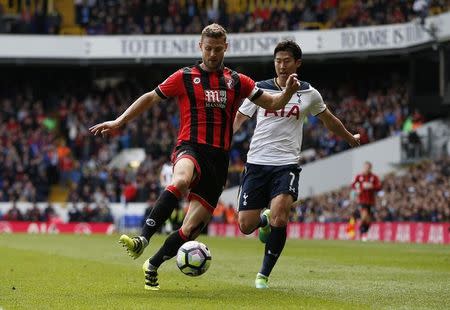 Britain Soccer Football - Tottenham Hotspur v AFC Bournemouth - Premier League - White Hart Lane - 15/4/17 Bournemouth's Simon Francis in action with Tottenham's Son Heung-min Action Images via Reuters / Paul Childs Livepic