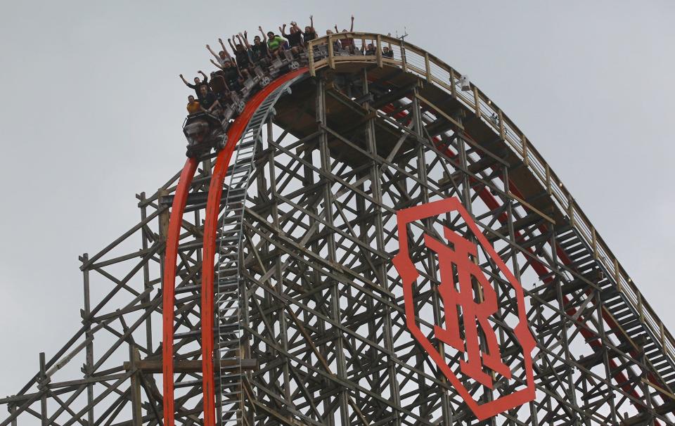 Guests of Six Flags Fiesta Texas ride the Iron Rattler in 2013. With temperatures in Texas stuck in the triple-digit range, crowds are light at the amusement park this summer.