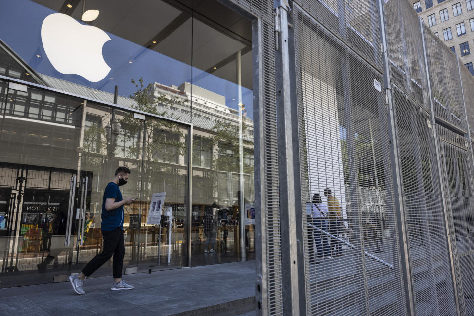 Security gates surround the Apple store on Thursday, June 3, 2021 in Portland, Ore. Until a year ago, the city was best known nationally for its ambrosial food scene, craft breweries and “Portlandia” hipsters. Now, months-long protests following the killing of George Floyd, a surge in deadly gun violence, and an increasingly visible homeless population have many questioning whether Oregon’s largest city can recover. (AP Photo/Paula Bronstein)