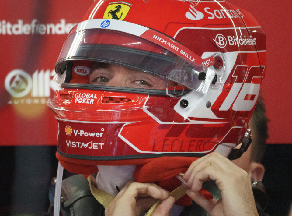 Ferrari driver Charles Leclerc of Monaco adjusts his helmet as he gets ready for the second practice session for the Formula 1 Canadian Grand Prix auto race Friday, June 7, 2024, in Montreal. (Paul Chiasson/The Canadian Press via AP)