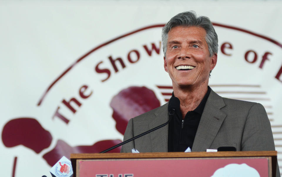 Ring announcer Michael Buffer smiles while giving his acceptance speech at the International Boxing Hall of Fame induction ceremony in Canastota, N.Y., Sunday, June 10, 2012. (AP photos/Heather Ainsworth)