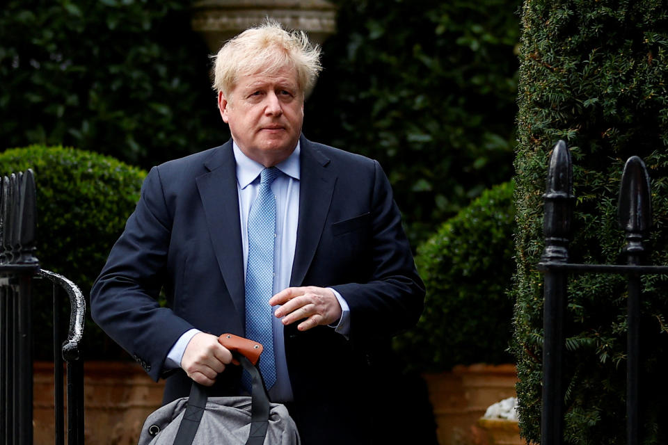 Former British Prime Minister Boris Johnson walks outside his home, in London, Britain, March 22, 2023. REUTERS/Peter Nicholls