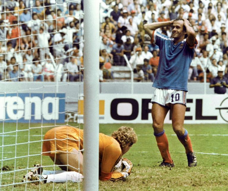 West Germany's Harald Schumacher (left) stops a shot from Michel Platini (right) in the World Cup semi-final in Guadalajara on June 25, 1986