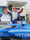 Alex Palou celebrates his victory in an IndyCar race at Road America in Elkhart Lake, Wisc., Sunday, June 20, 2021. (AP Photo/Jeffrey Phelps)