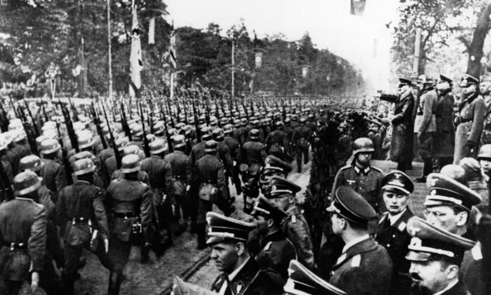 German troops parade in front of Adolf Hitler and Nazi Generals after entry into Warsaw, 5 October 1939.