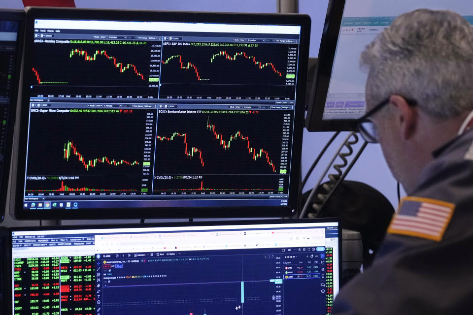 A trader works on the trading floor of the New York Stock Exchange on Wednesday, Aug. 7, 2024. (AP Photo/Richard Drew)