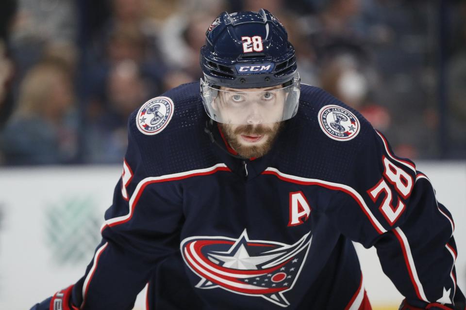 Columbus Blue Jackets right wing Oliver Bjorkstrand (28) lines up for a faceoff during the third period of the season opening NHL hockey game at Nationwide Arena in Columbus on Thursday, Oct. 14, 2021. Bjorkstrand had two goals in the 8-2 win.