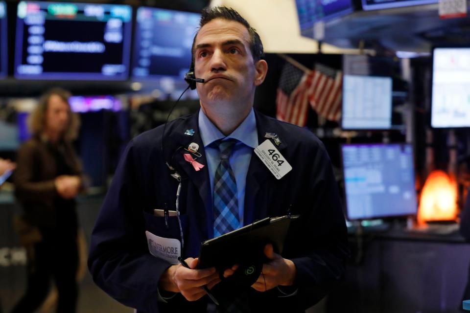 Trader Gregory Rowe works on the floor of the New York Stock Exchange on March 6, 2020.