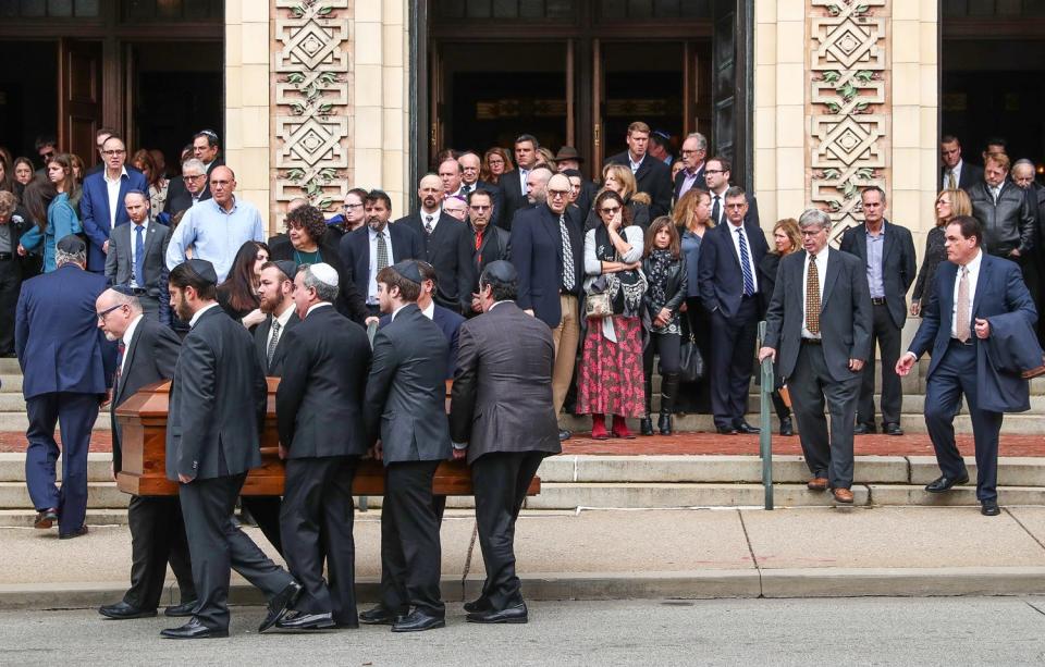 The caskets of brothers David and Cecil Rosenthal are carried out of Rodef Shalom Synagogue in Pittsburgh on Tuesday, Oct. 30, 2018. 