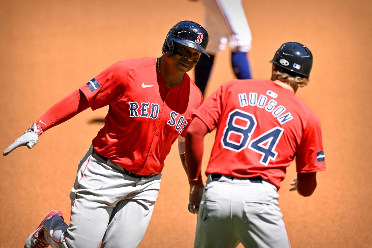 Red Sox third baseman Rafael Devers rounds the bases after he hits a home run against the Texas Rangers at Globe Life Field in the final preseason game on Tuesday.
