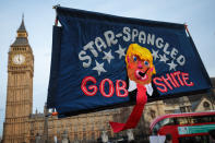 <p>A banner depicting U.S. President Donald Trump is held up during a rally in Parliament Square against his state visit to the U.K. on Feb. 20, 2017 in London, England. (Photo: Jack Taylor/Getty Images) </p>