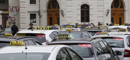FILE PHOTO: Taxis are seen parked in front of the presidential palace during a protest against the online car-sharing service Uber in Vienna