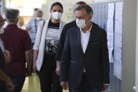 Miroslav Skoro, leader of the Homeland Movement leaves after his vote at a polling station in Zagreb, Croatia, Sunday, July 5, 2020. Amid a spike of new coronavirus cases, voters in Croatia cast ballots on Sunday in what is expected be a close parliamentary race that could push the latest European Union member state further to the right. (AP Photo/Daniel Kasap)