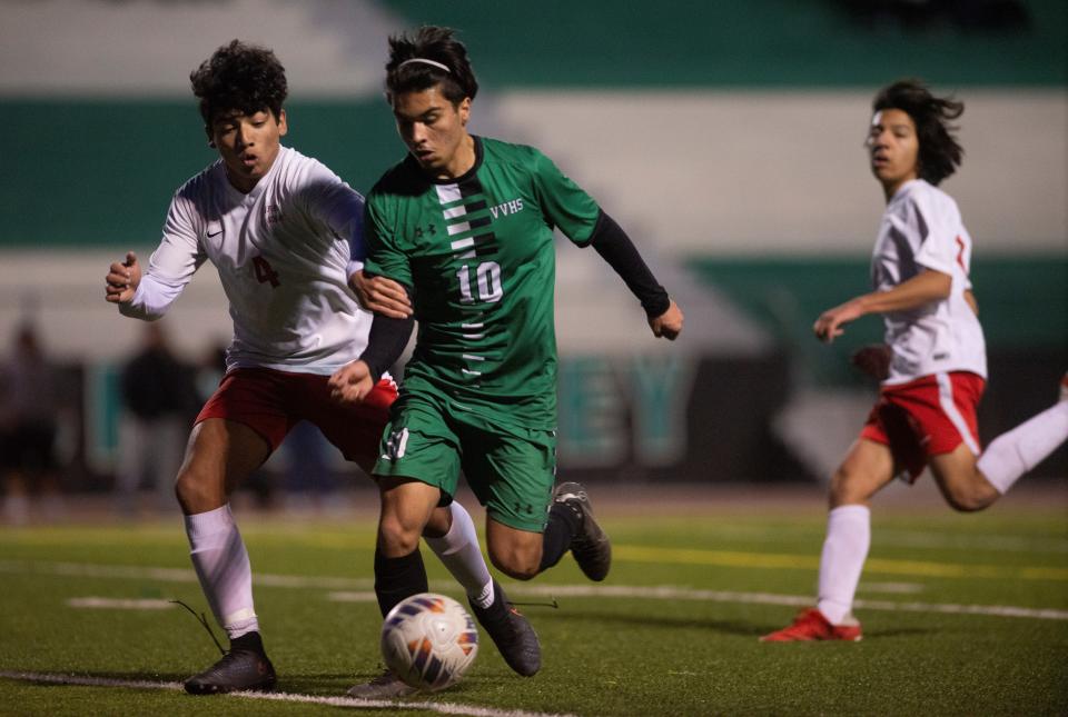 Victor Valley's Josiah Paez battles for possession during the second half against Oxford Academy on Thursday, March 2, 2023.
