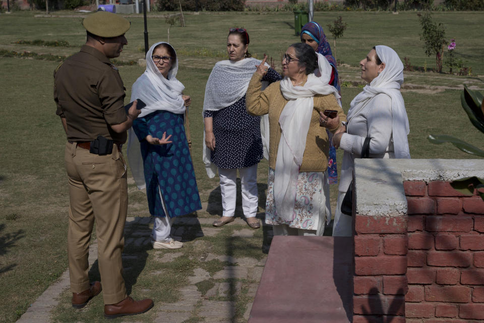 Kashmiri women argue with an Indian police officer after they were stopped from staging a protest in Srinagar, Indian controlled Kashmir, Tuesday, Oct. 15, 2019. Police detained a small group of women who had gathered for a peaceful protest to condemn Indian government downgrading the region's semi-autonomy and demanded restoration of civil liberties and fundamental rights of citizens. (AP Photo/Dar Yasin)