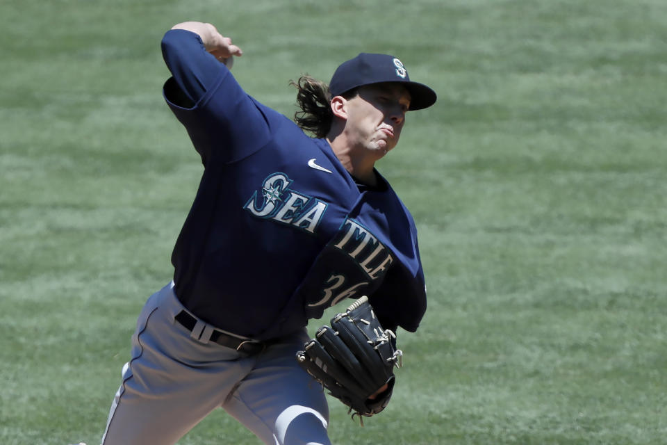 Seattle Mariners starting pitcher Logan Gilbert throws to a Los Angeles Angels batter during the first inning of a baseball game in Anaheim, Calif., Sunday, June 6, 2021. (AP Photo/Alex Gallardo)