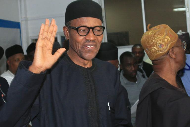 Nigerian president-elect Muhammadu Buhari waves in Abuja on April 1, 2015