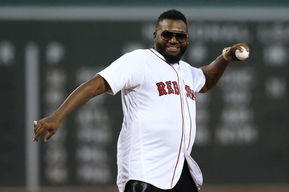 Former Boston Red Sox's David Ortiz throws out a ceremonial first pitch before a baseball game against the New York Yankees in Boston, Monday, Sept. 9, 2019. (AP Photo/Michael Dwyer)