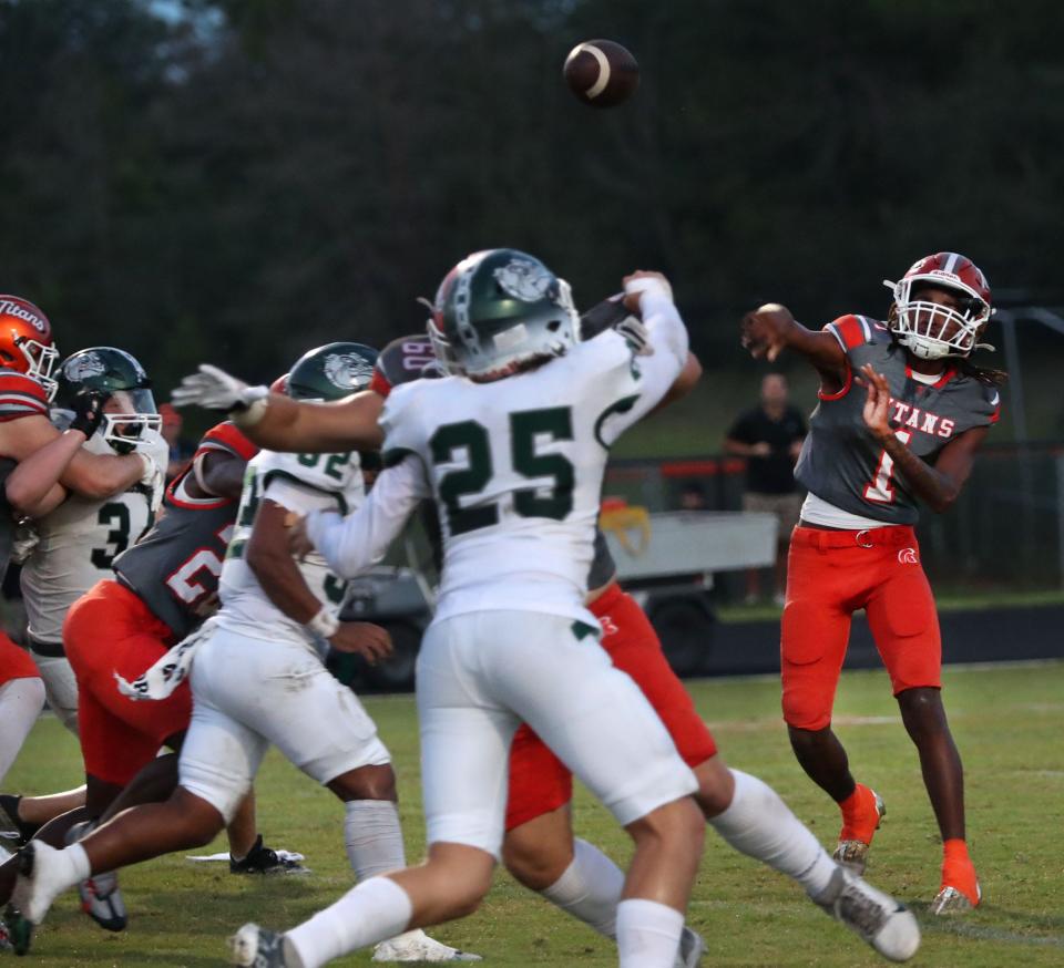 University QB Malachi Walters (1) throws against Flagler Palm Coast, Thursday, Sept. 21, 2023.