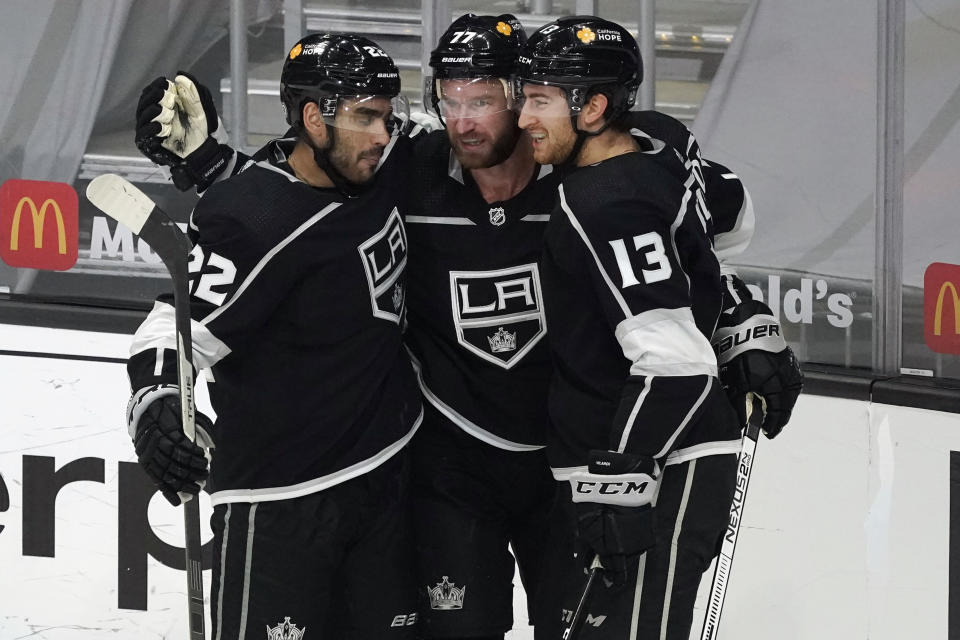 Los Angeles Kings center Jeff Carter, center, celebrates his goal with Andreas Athanasiou (22) and Gabriel Vilardi (13) during the second period of an NHL hockey game against the St. Louis Blues, Friday, March 5, 2021, in Los Angeles. (AP Photo/Marcio Jose Sanchez)