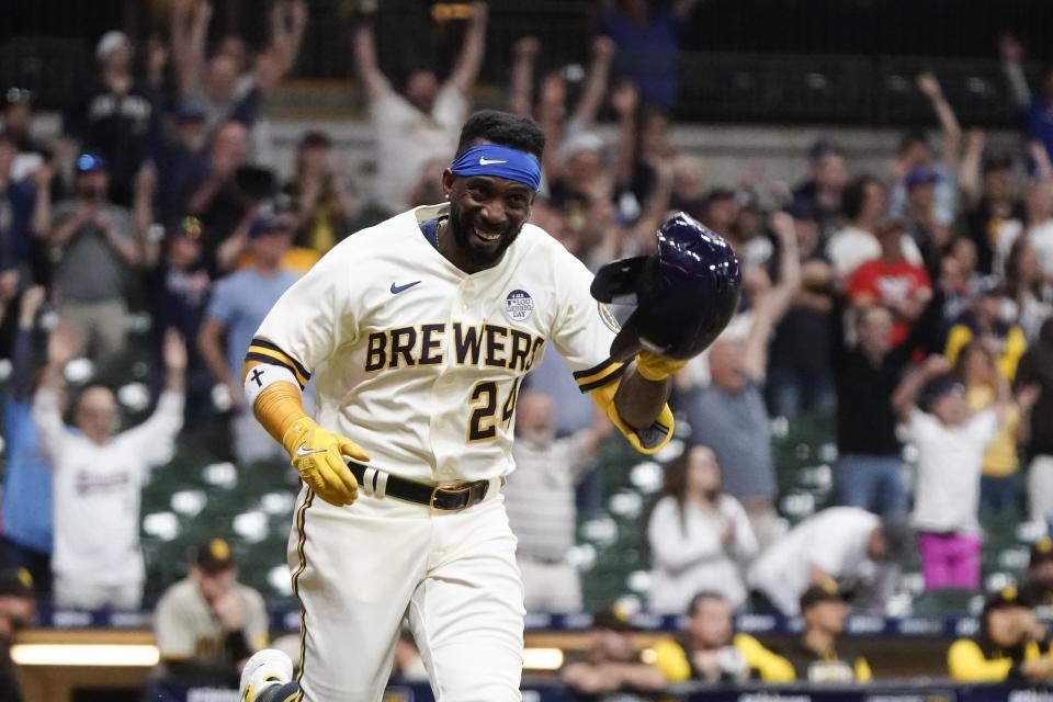 Milwaukee Brewers' Andrew McCutchen celebrates after hitting a walk-off RBI single during the ninth inning of a baseball game against the San Diego Padres Thursday, June 2, 2022, in Milwaukee. The Brewers won 5-4. (AP Photo/Morry Gash)