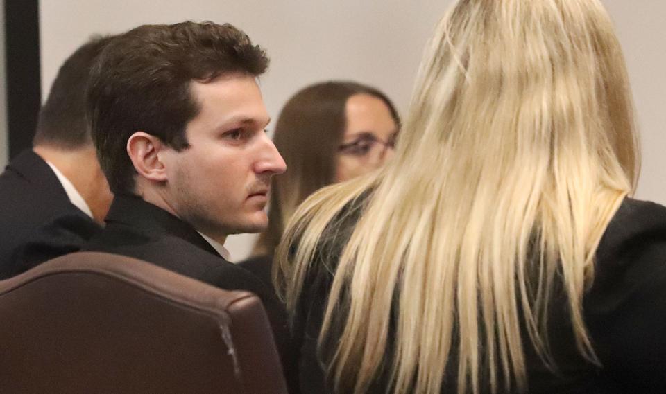 Noah Motto sits with his defense team, Wednesday, Sept. 7, 2022, during his trial at the S. James Foxman Justice Center in Daytona Beach. He is charged with vehicular homicide and leaving the scene of an accident that killed his girlfriend, Ericka Dane, on March 24, 2021.
