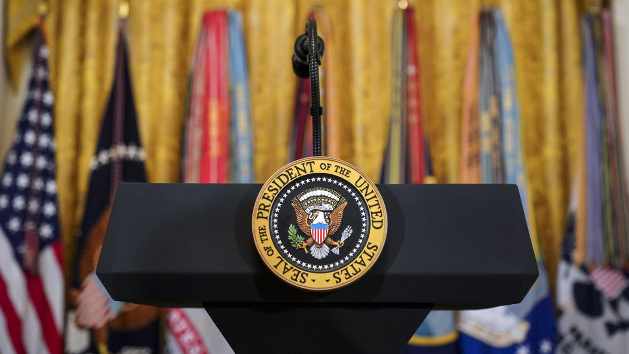 The presidential seal displayed in the East Room of the White House