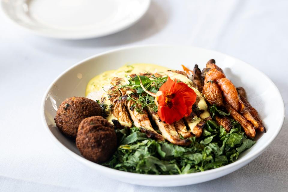Tandoori chicken is an option on the Mediterranean bowl at HoQ in the East Village.