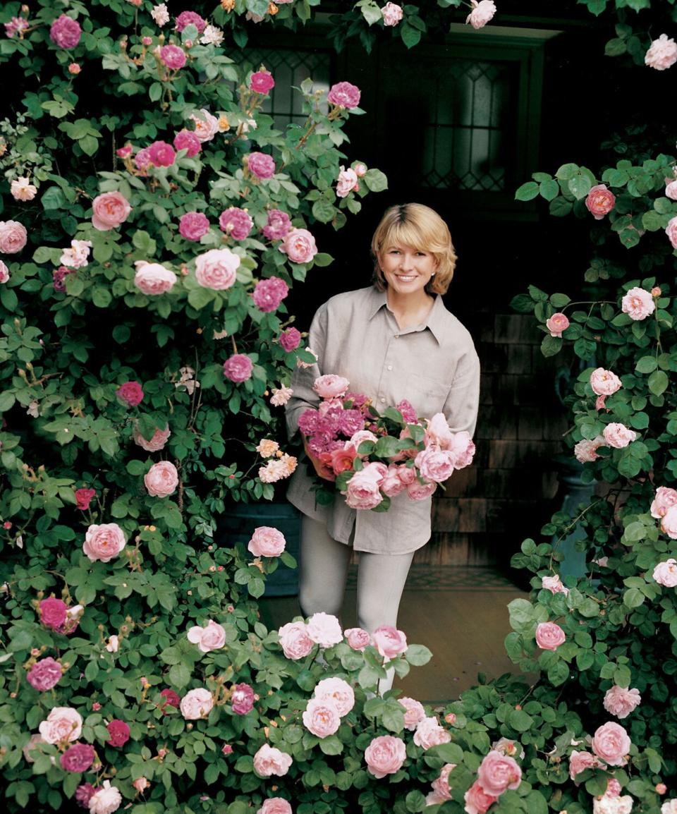 martha holding flowers at lily pond