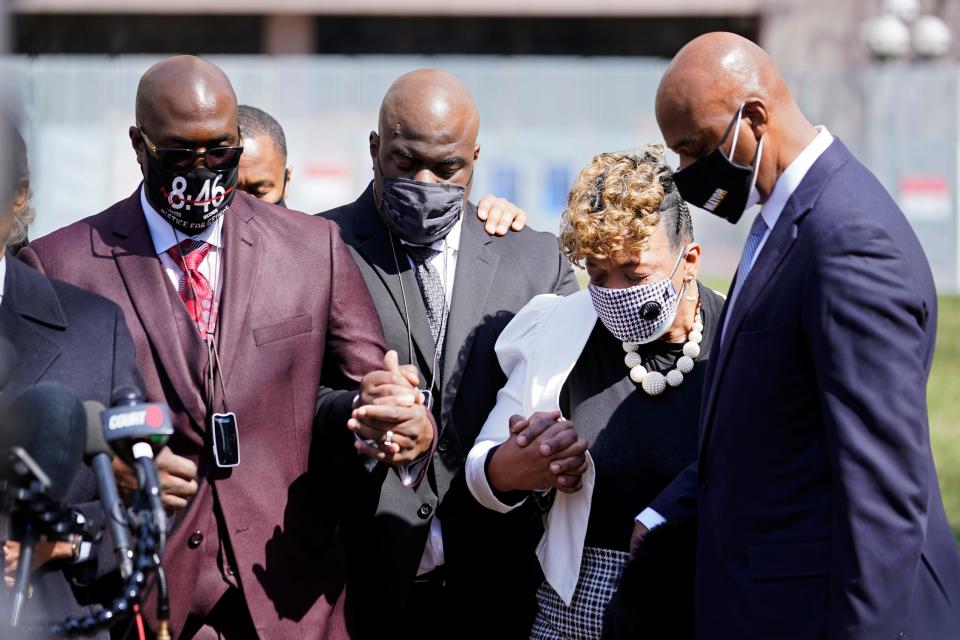 Philonise Floyd, left, the brother of George Floyd and other family members along with Gwen Carr, the mother of Eric Garner, take part in a prayer vigil led by the Rev. Al Sharpton outside the Hennepin County Government Center during lunch break Tuesday, April 6, 2021, in Minneapolis where testimony continues in the trial of former Minneapolis police officer Derek Chauvin.