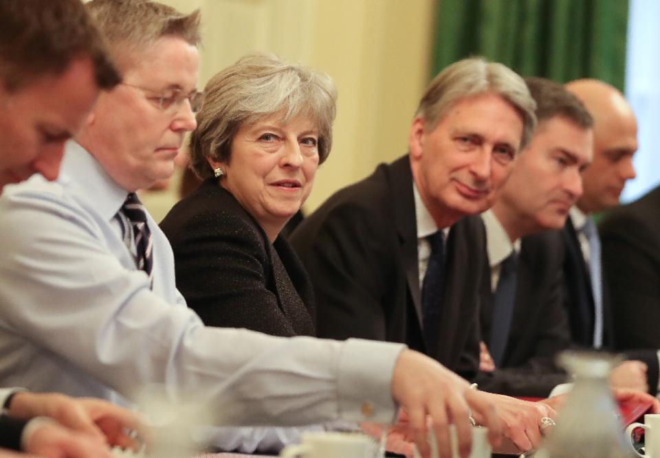 Prime Minister Theresa May, flanked by chancellor Philip Hammond, have pledged to take action against aggressive tax avoidance (AFP/Daniel LEAL-OLIVAS)