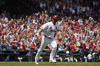 St. Louis Cardinals' Albert Pujols celebrates as he rounds the bases after hitting a grand slam during the third inning of a baseball game against the Colorado Rockies Thursday, Aug. 18, 2022, in St. Louis. (AP Photo/Jeff Roberson)