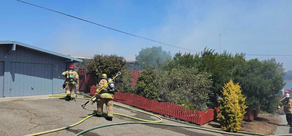 Firefighters respond to a fire at a home near the 600 block of Santa Lucia Avenue and Second Street on May 21, 2024.