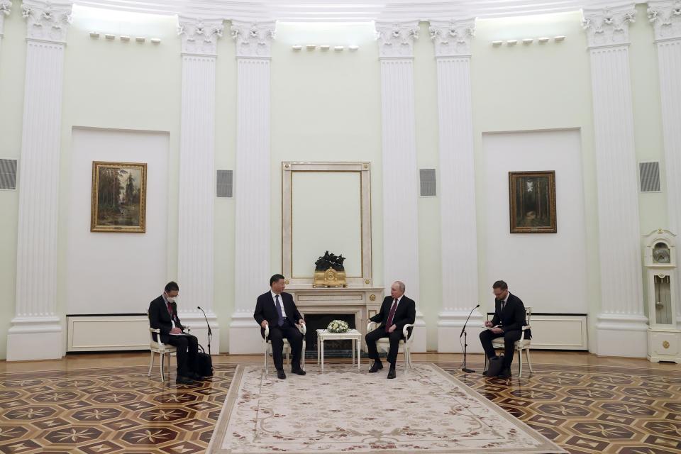 Chinese President Xi Jinping and Russian President Vladimir Putin talk to each other during their meeting at the Kremlin in Moscow, Russia, Monday, March 20, 2023. (Sergei Karpukhin, Sputnik, Kremlin Pool Photo via AP)