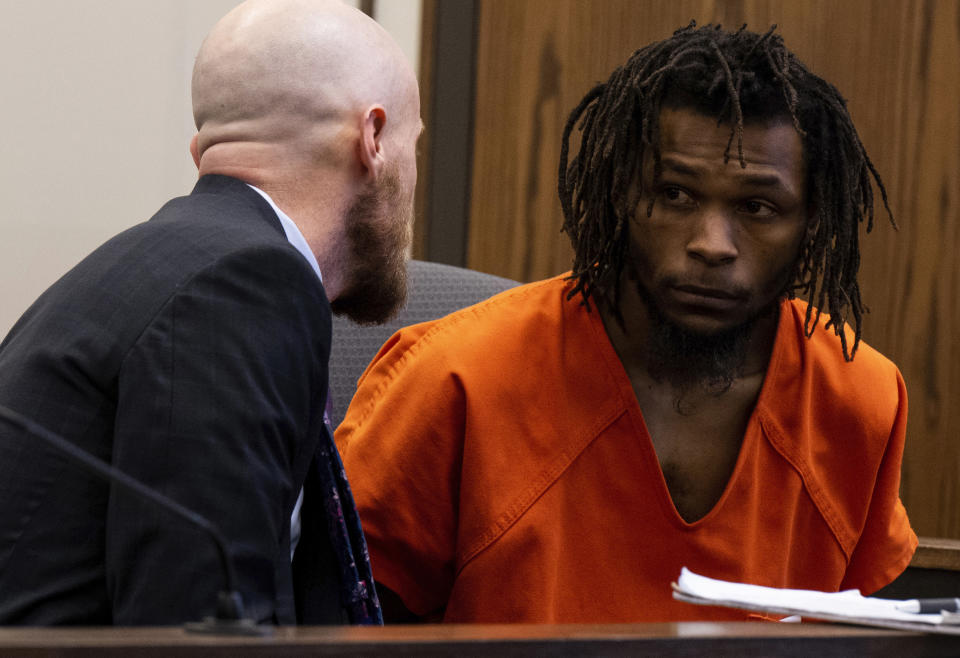 Nicholas Jordan, right, speaks with his lawyer Nick Rogers during his first appearance in El Paso County 4th Judicial Court Friday, Feb. 23, 2024, in Colorado Springs, Colo. Jordan was arrested Monday, Feb. 19, in the deaths of his roommate, Samuel Knopp, 24, and Celie Rain Montgomery, 26, at the University of Colorado Colorado Springs. (Parker Seibold/The Gazette via AP, Pool)