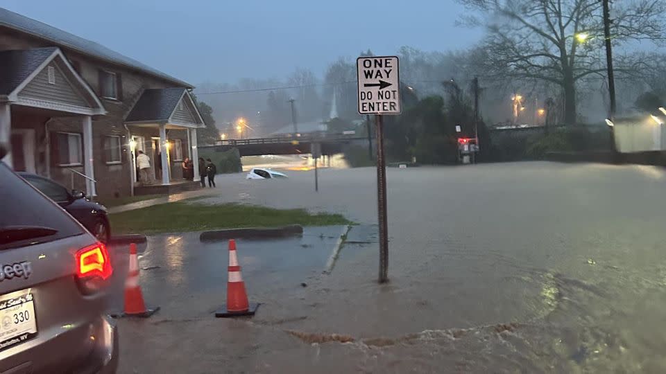 A car is seen submerged in floodwater in Charleston, West Virginia. - City of Charleston