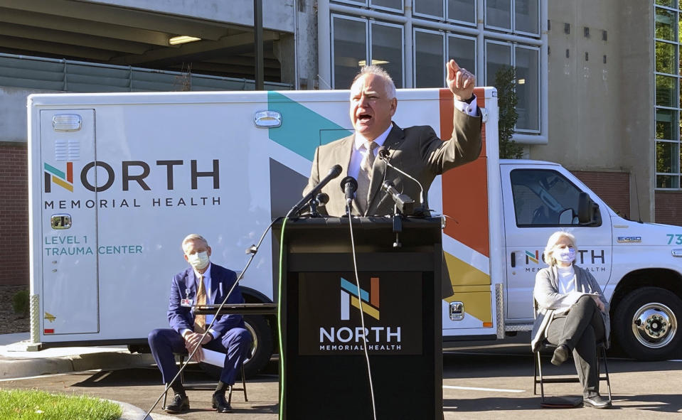 Minnesota Gov. Tim Walz announces measures on Friday, Oct. 15, 2021, to use the Minnesota National Guard to alleviate staffing shortages at health care facilities that have been hit hard by the COVID-19 surge. The governor spoke outside North Memorial Health Hospital in the Minneapolis suburb of Robbinsdale. (AP Photo/Grant Schulte)