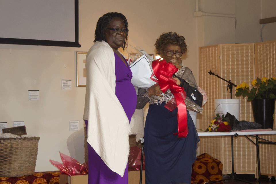 Greater Gainesville Black Nurses Association President Rachael Drayton, left, gifts past GGBNA president Voncea Brusha with roses. Brusha served as president of the group from 2005-2021.
(Credit: Photo by Voleer Thomas/For The Guardian)