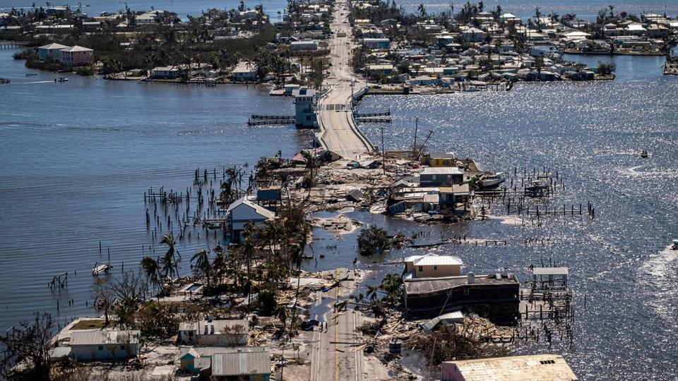 File: An aerial picture taken on September 30, 2022 shows the only access to the Matlacha neighborhood destroyed in the aftermath of Hurricane Ian in Fort Myers, Florida.