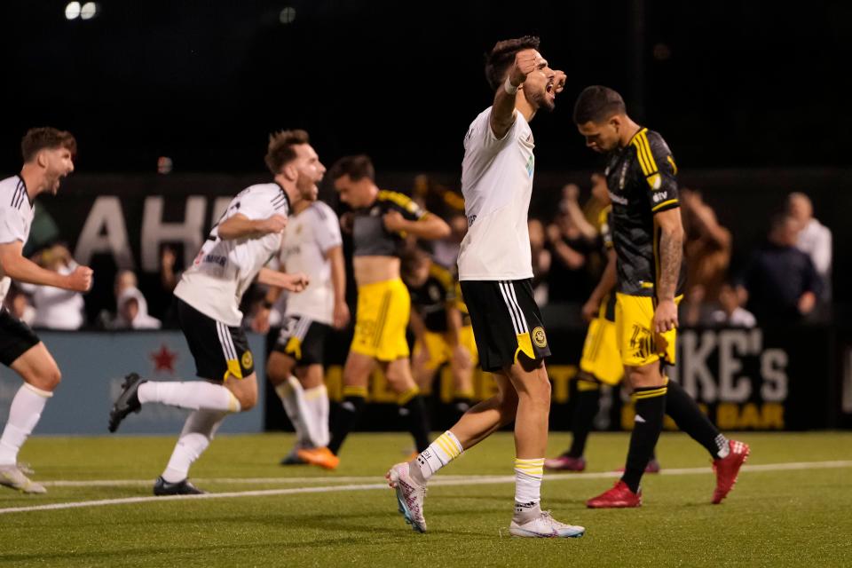 Pittsburgh Riverhounds players celebrate their 1-0 win over the Crew on Wednesday.