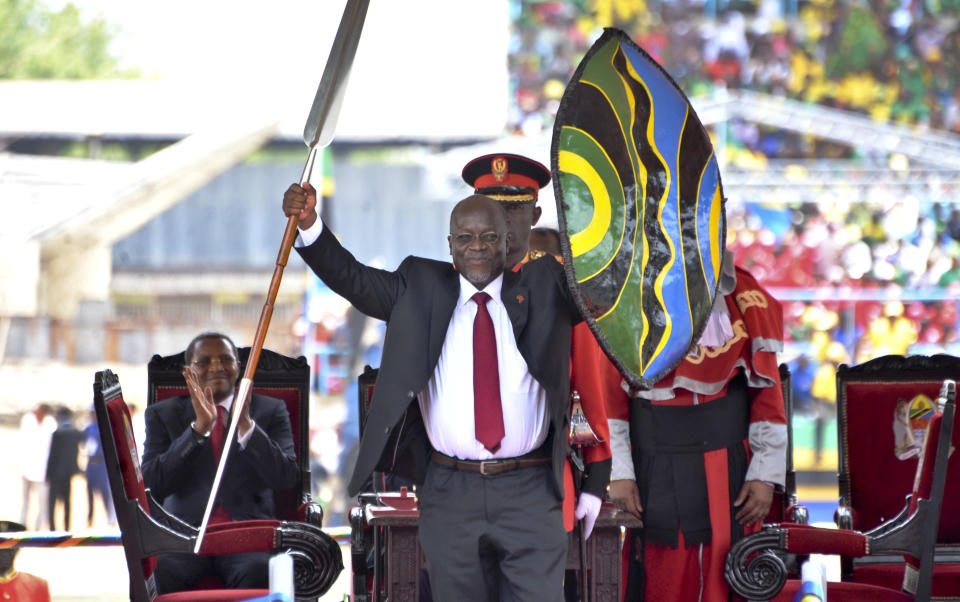 FILE - In this Thursday, Nov. 5, 2015 file photo, Tanzania's President John Magufuli holds up a ceremonial spear and shield to signify the beginning of his presidency, shortly after swearing an oath during his inauguration ceremony at Uhuru Stadium in Dar es Salaam, Tanzania. Opposition politicians on Wednesday March 10 2021, are raising questions about the health of Tanzania's COVID-19-denying president John Magufuli, as he has not been seen in public for more than a week and there has been no responce to questions from The Associated Press about Magufuli’s health and whereabouts. (AP Photo/Khalfan Said, File)